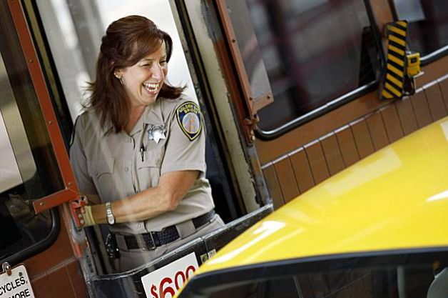 Toll-Booth-Attendant-Talking-To-Car-Passenger