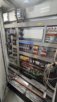 Electrical enclosure with heavy dust and debris affecting airflow before cleaning