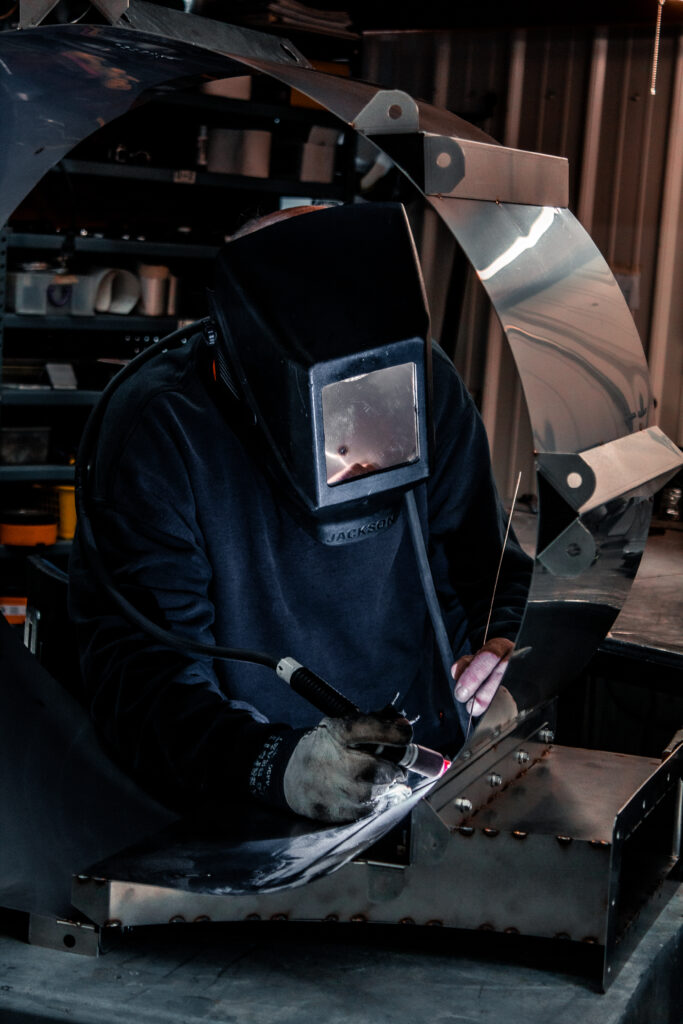 Welder welding an Air Cleaning Blower